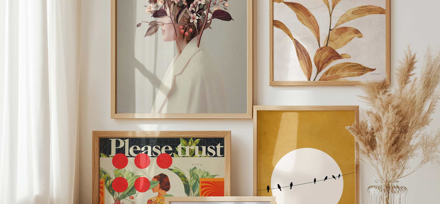 Bright room with several framed prints on the wall